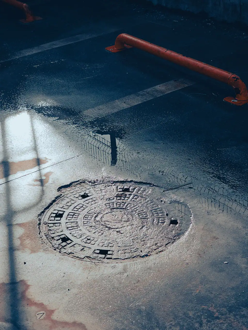 Manhole cover over a blocked drain in Swindon, The Drain Masters
