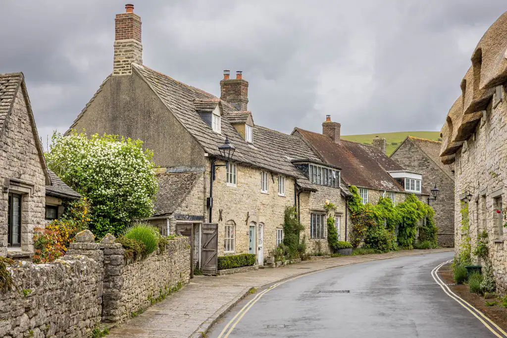 Stone cottages along a Wiltshire country road near Devizes, drainage services by The Drain Masters
